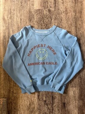 American Eagle Outfitters Blue 'Happiest Here' crewneck. no size tag. Likely XS